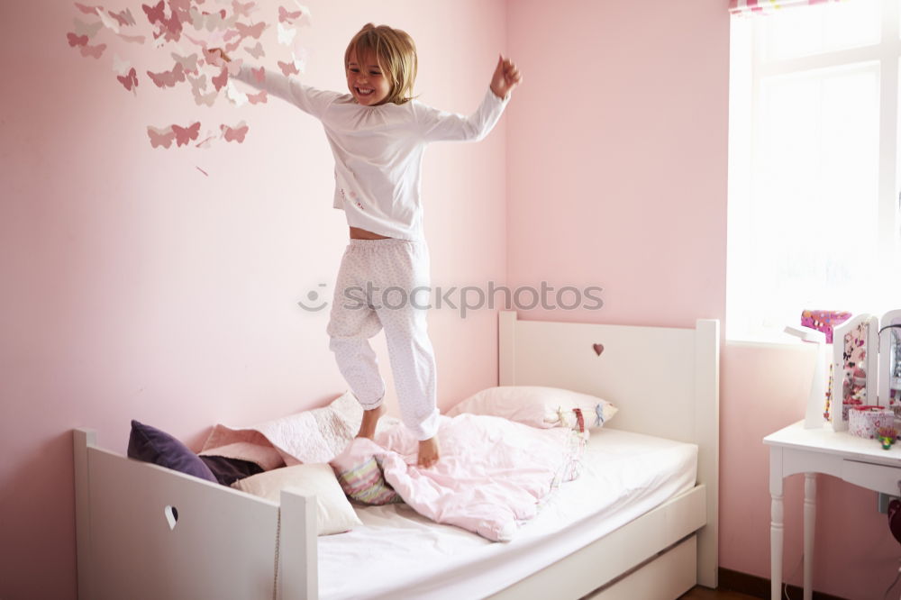 Similar – Image, Stock Photo beautiful kid girl playing and jumping on bed