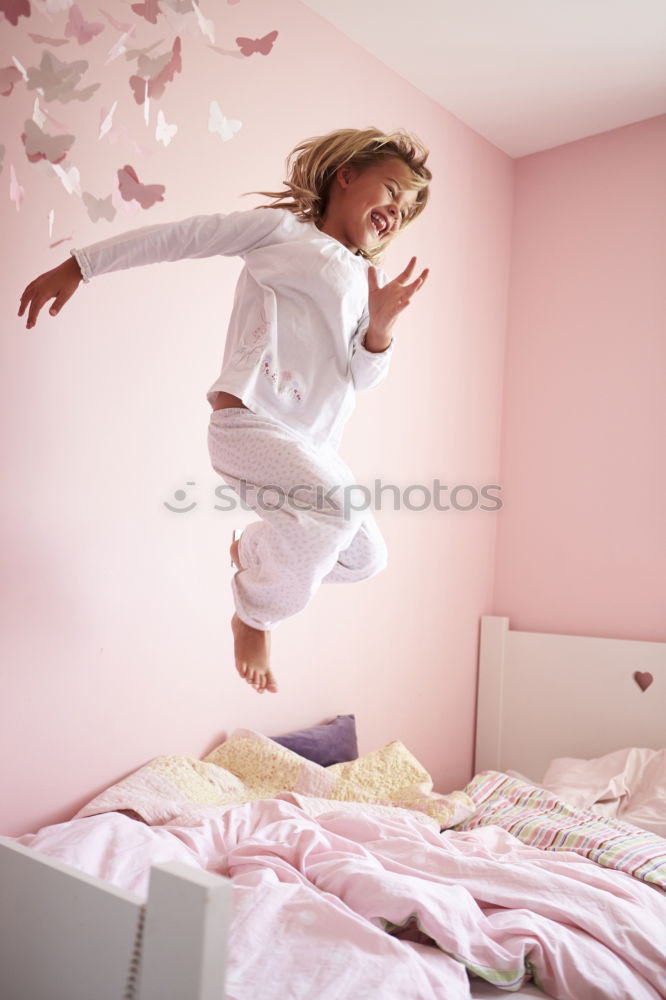 Similar – beautiful kid girl jumping on bed