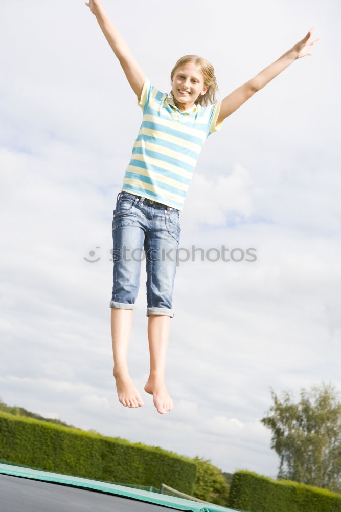 Similar – Funny blonde woman jumping in urban background.