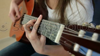 Similar – Image, Stock Photo Vibration | Guitar Pages II Young Woman Playing Guitar