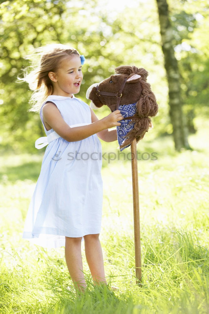 Similar – Image, Stock Photo happy child girl watering flowers with hose in summer