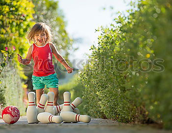 Similar – Image, Stock Photo child plays soccer with a ball