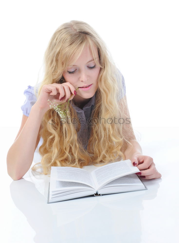 Similar – Image, Stock Photo Schoolgirl reading a book in classroom