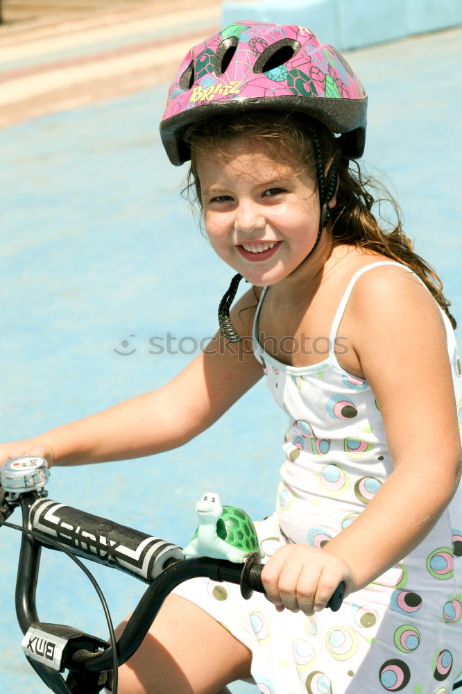 Similar – Cool gap | Portrait of a boy with a bicycle helmet and a tooth gap