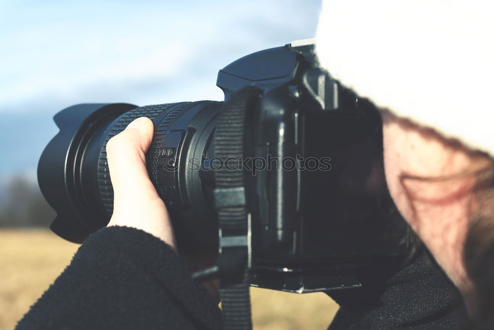 Similar – Hand taking shot of forest