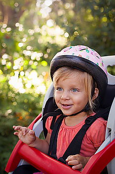 Similar – Young girl playing to driving a toy car