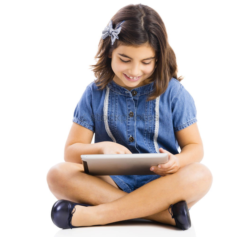 Similar – Little girl using a tablet at home