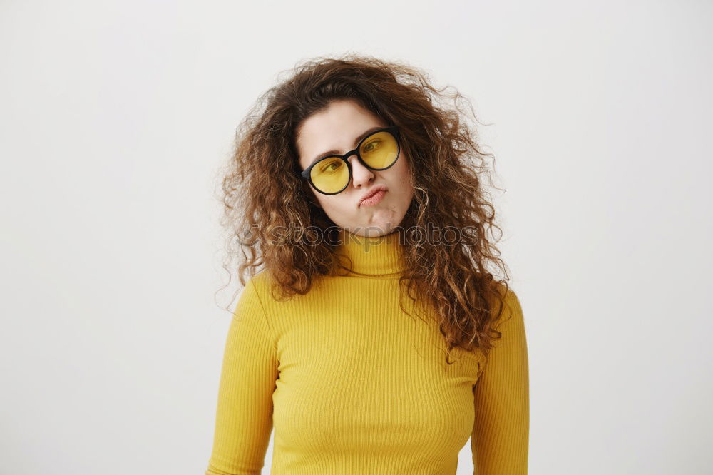 Similar – Cheerful woman in yellow jacket