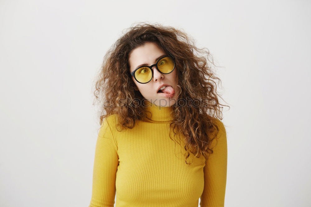 Cheerful woman in yellow jacket