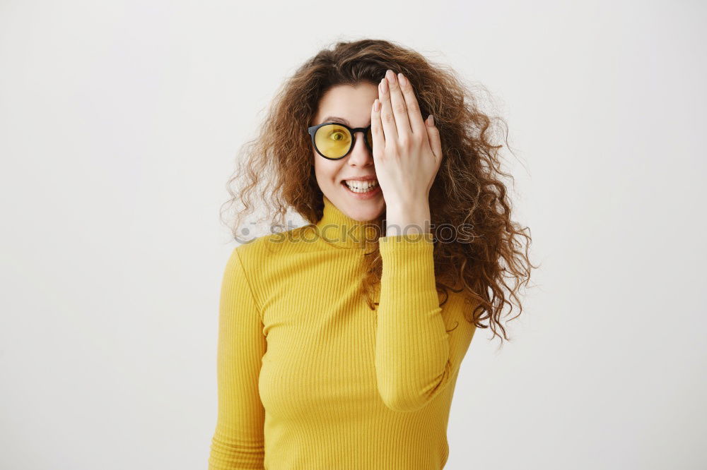 Similar – Cheerful woman in yellow jacket