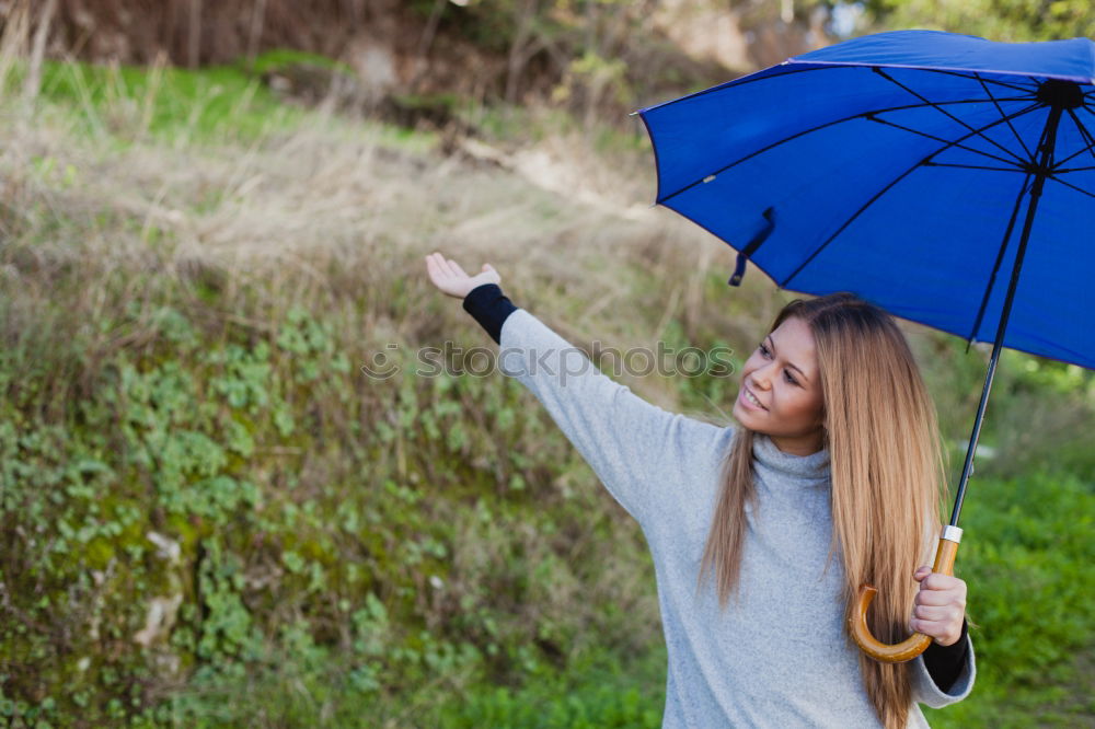 Similar – happy kid girl hiding under umbrella