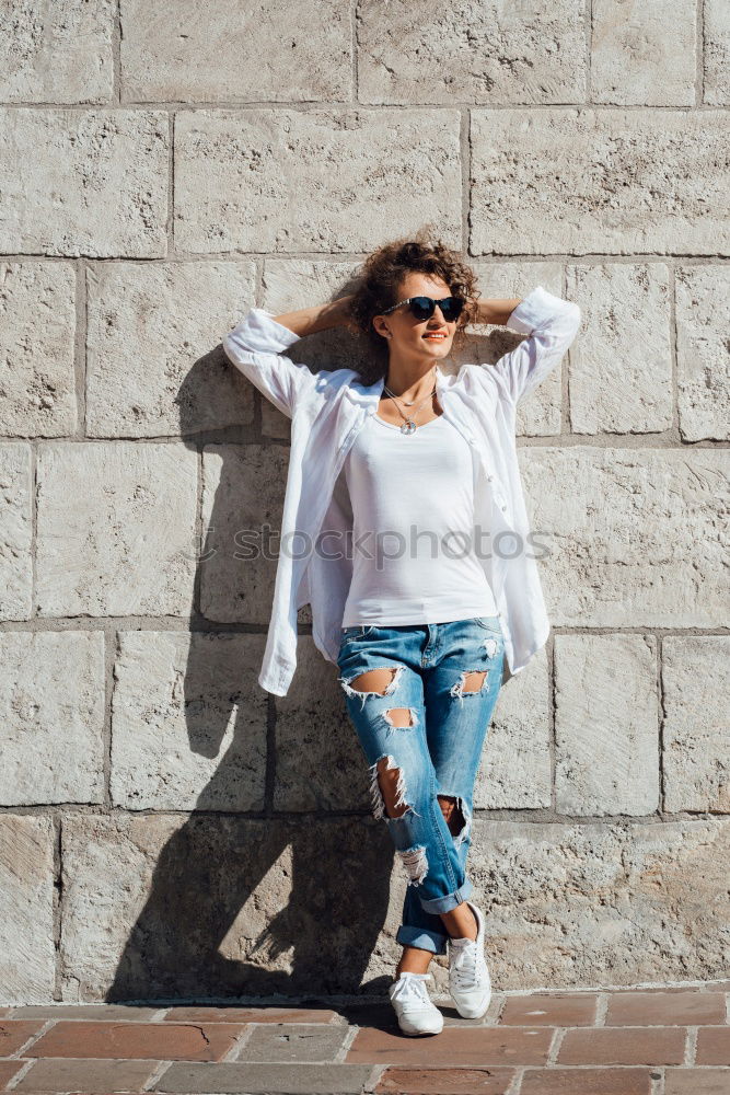 Similar – Stylish woman at brick wall