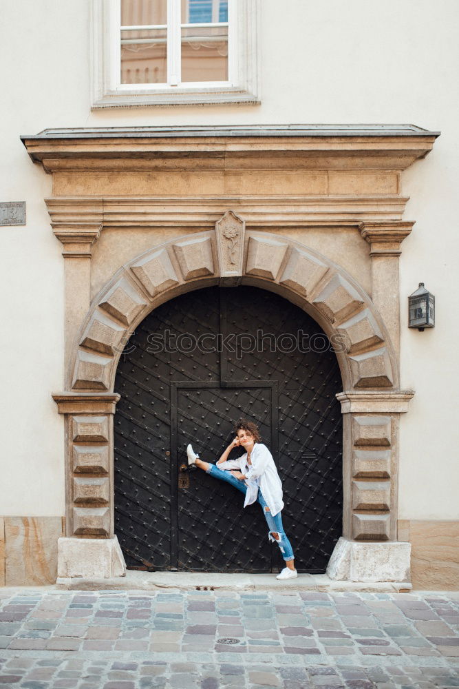 Similar – Woman jumps barefoot on blue rubber hills into the air with outstretched arms