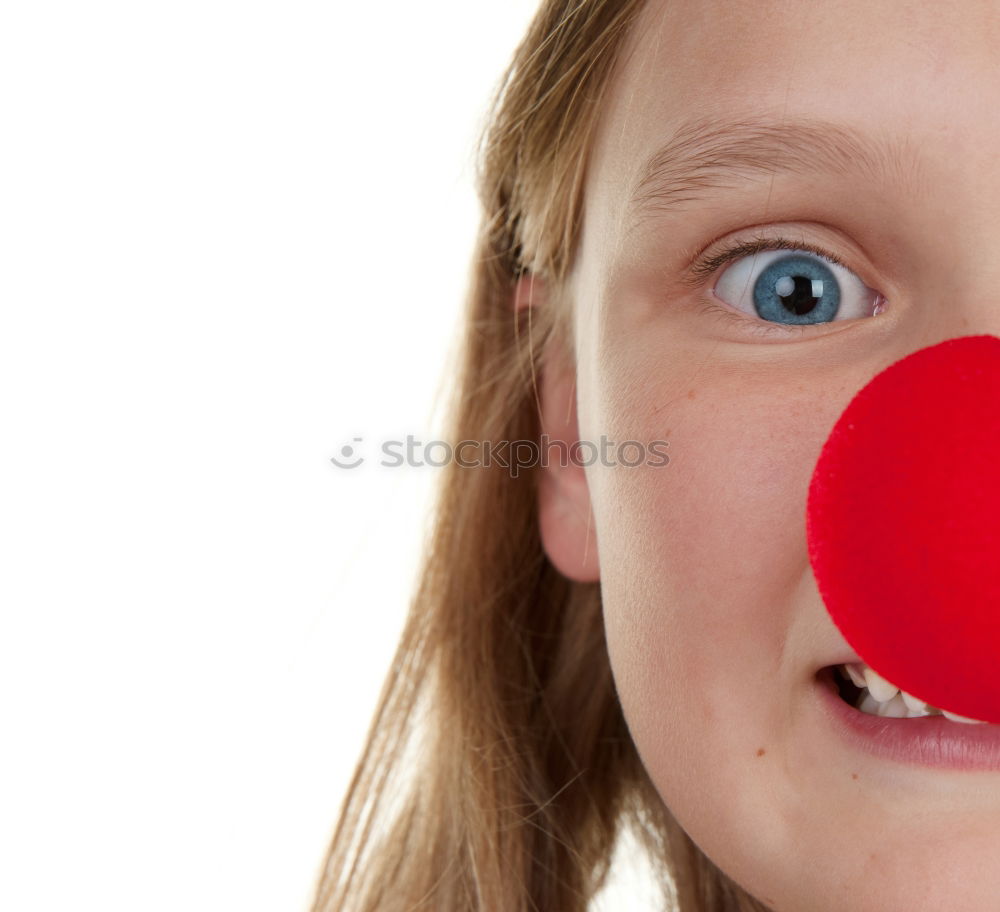 Similar – Girl with clown nose looks into the camera