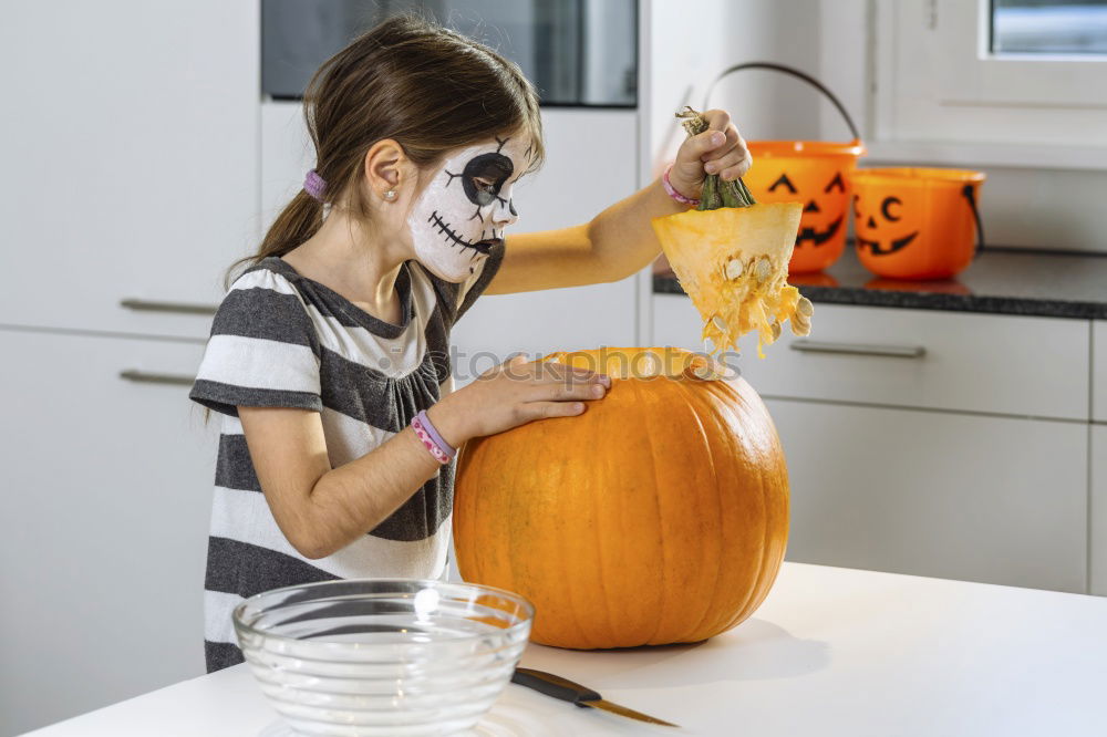 Similar – Image, Stock Photo Little girl holding a pumpkin in her hands, on Halloween.