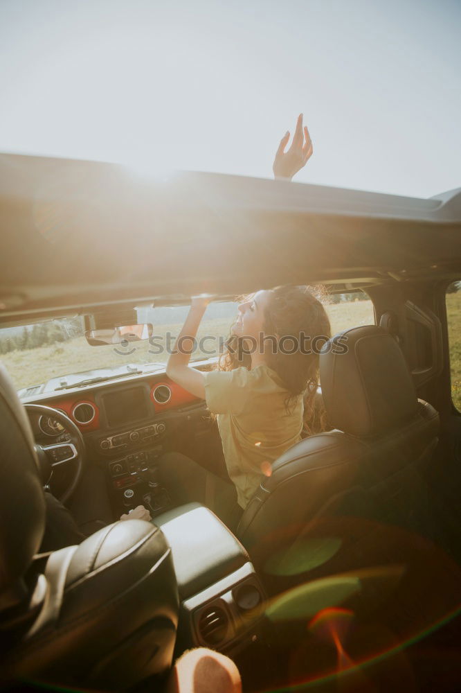 View of the street from the back seat of a vintage car