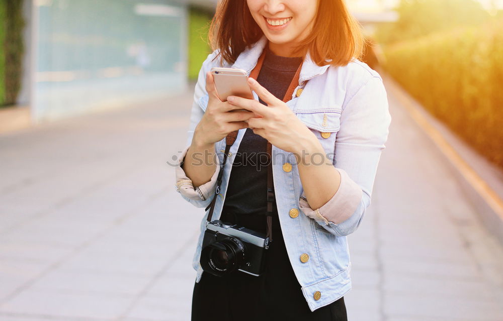 Similar – Image, Stock Photo Happy young woman with her mobile on the street