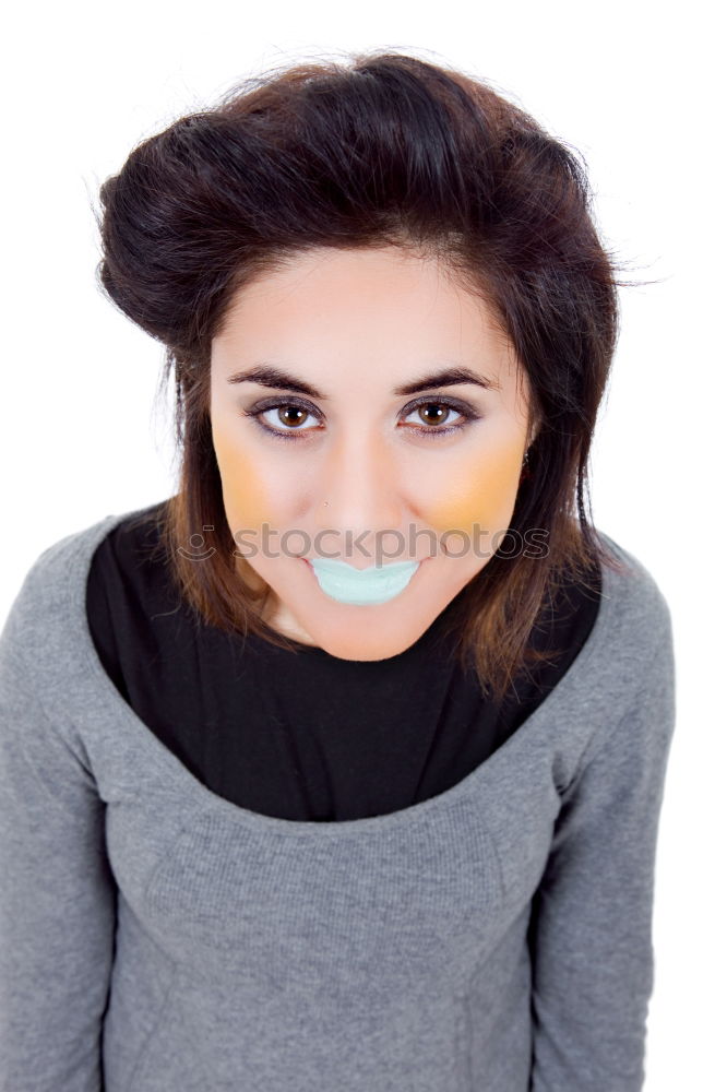 Similar – portrait of young woman eating bubble gum in brick background