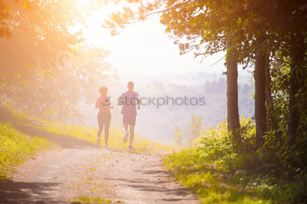 Similar – Image, Stock Photo Sporty woman running on a country road