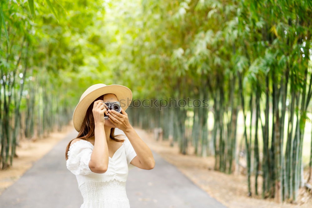 Similar – Close up of a photographer with her camera.