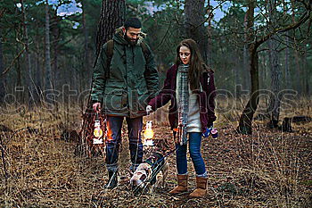 Similar – Image, Stock Photo young couple with dog is in the woods, the woman is pregnant