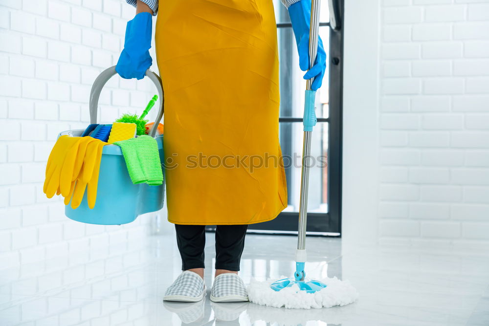 Similar – Image, Stock Photo A househusband in pink slippers and cleaning utensils