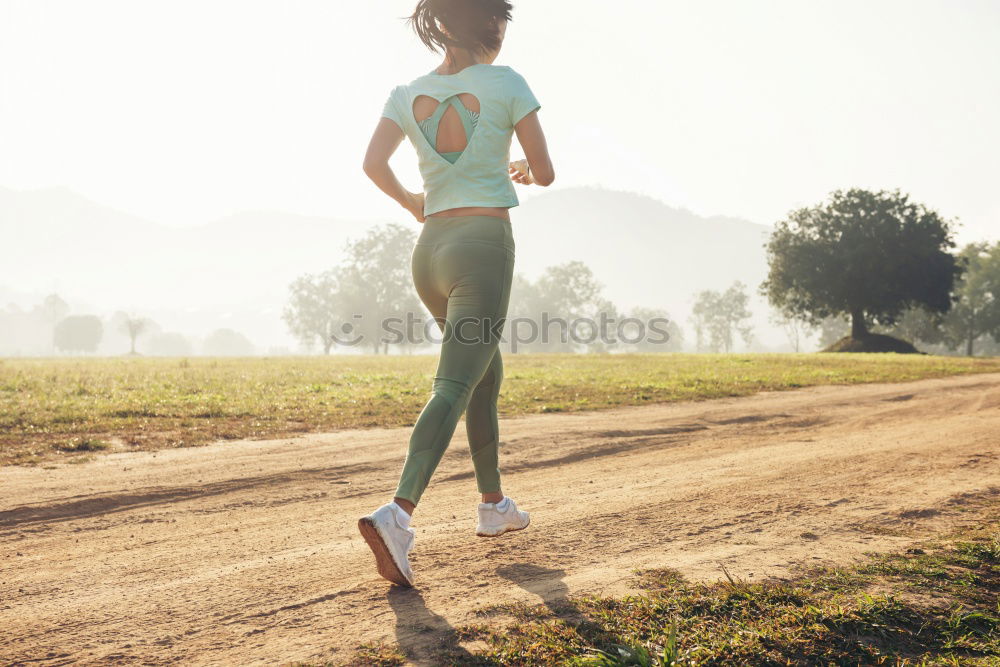 Similar – Young sporty woman jogging