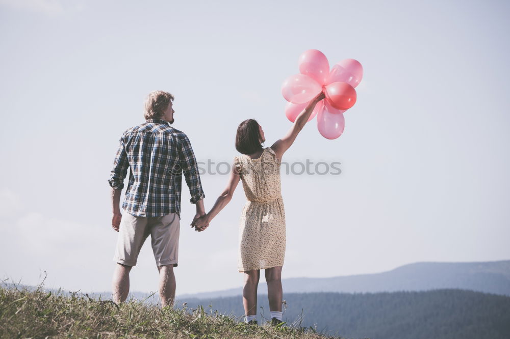 Similar – Image, Stock Photo Smiling young woman and man sitting on a pier over the sea