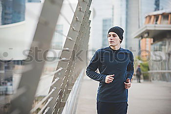 Similar – Young sports man is running up the stairs for his workout