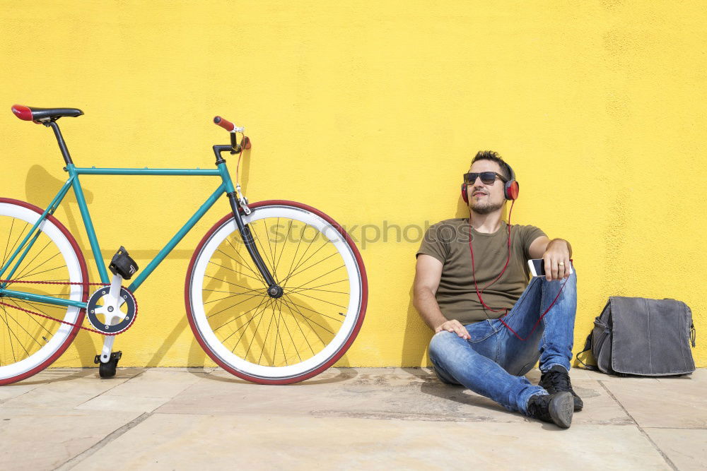 Similar – Image, Stock Photo Side view of a young hipster man with a fixed bike