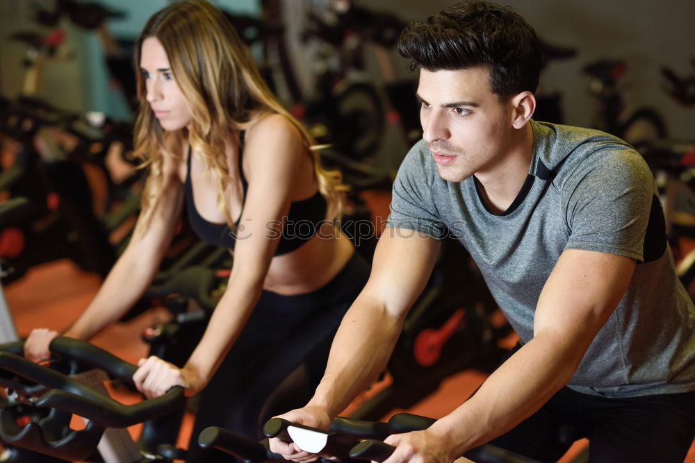 Similar – Image, Stock Photo Couple in a spinning class wearing sportswear.