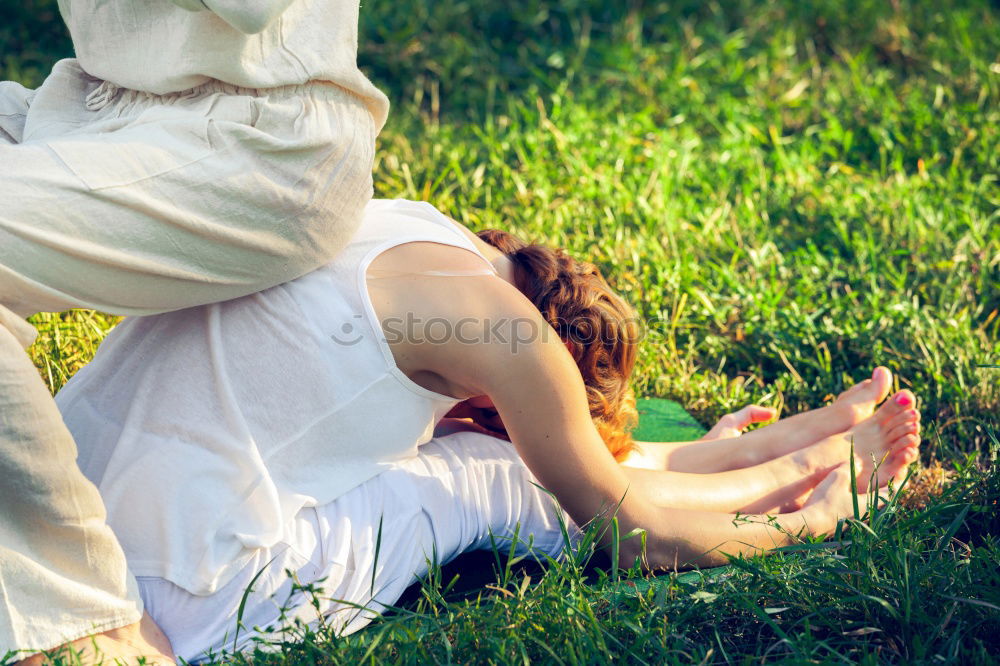 Similar – Image, Stock Photo Mother and daughter doing yoga exercises on grass in the park at the day time