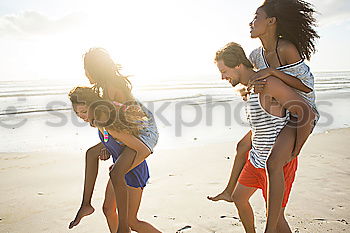 Similar – Happy best friends having good time on the beach together