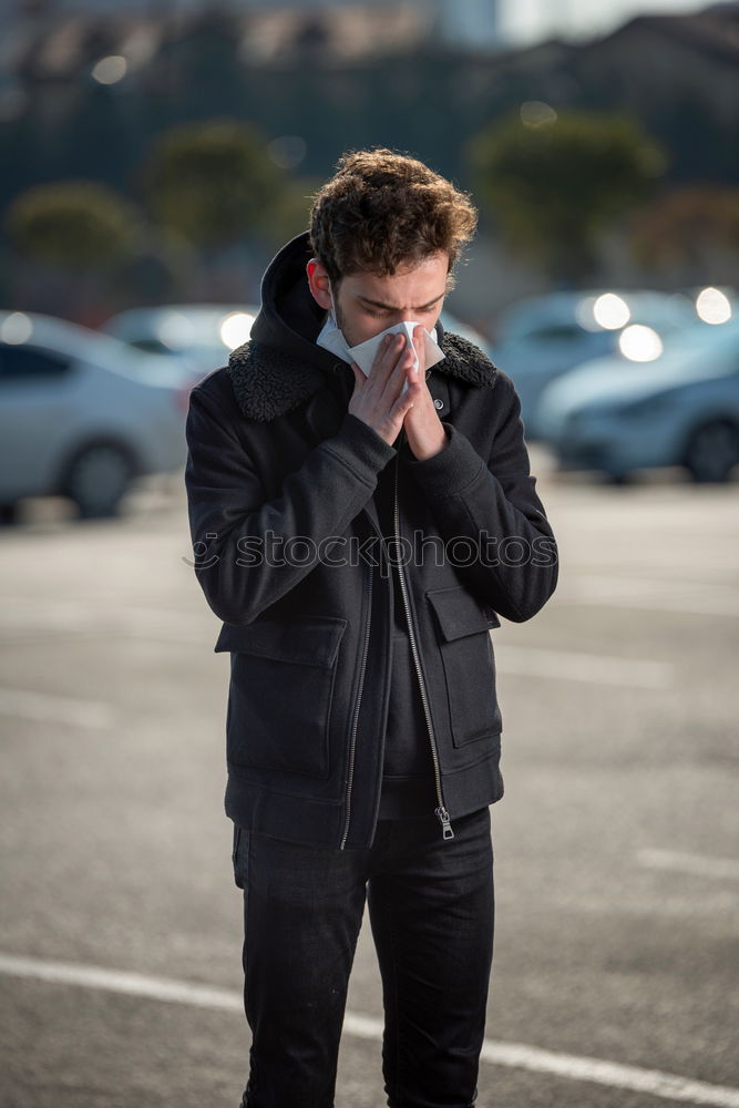 Similar – Young man standing in the city center wearing the face mask to avoid virus infection