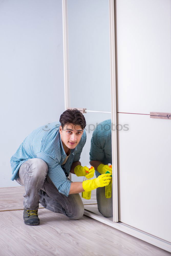 Similar – Image, Stock Photo Interracial couple painting a wardrobe