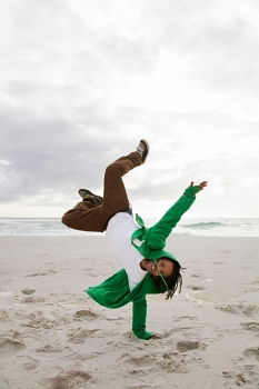 Similar – Young female athlete doing exercise on beach