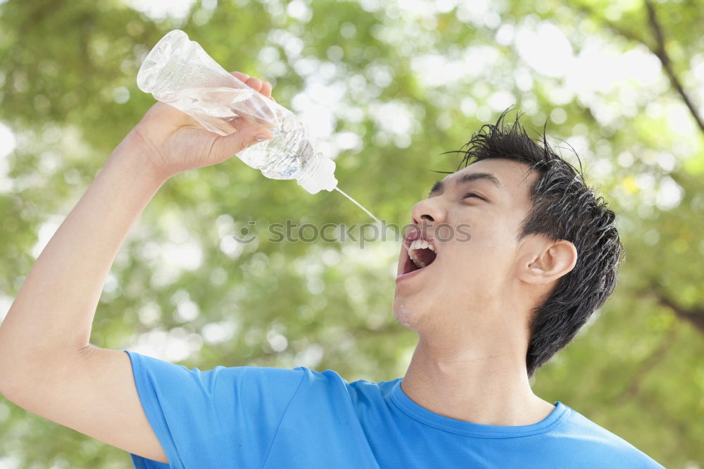 Similar – Young man drinking bottled water