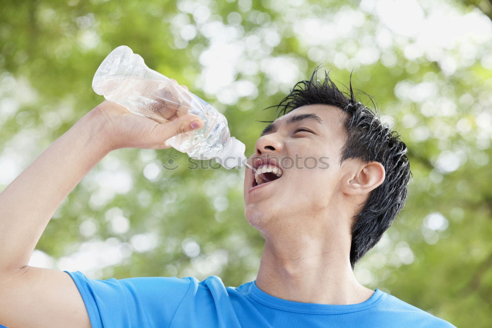 Similar – Young man drinking bottled water