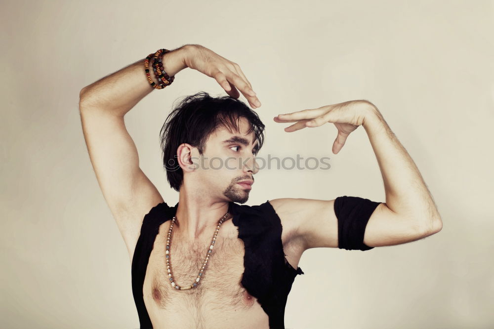 Similar – Image, Stock Photo young man spreads his arms like an angel while leaning against the wall with a tattoo on his bare chest