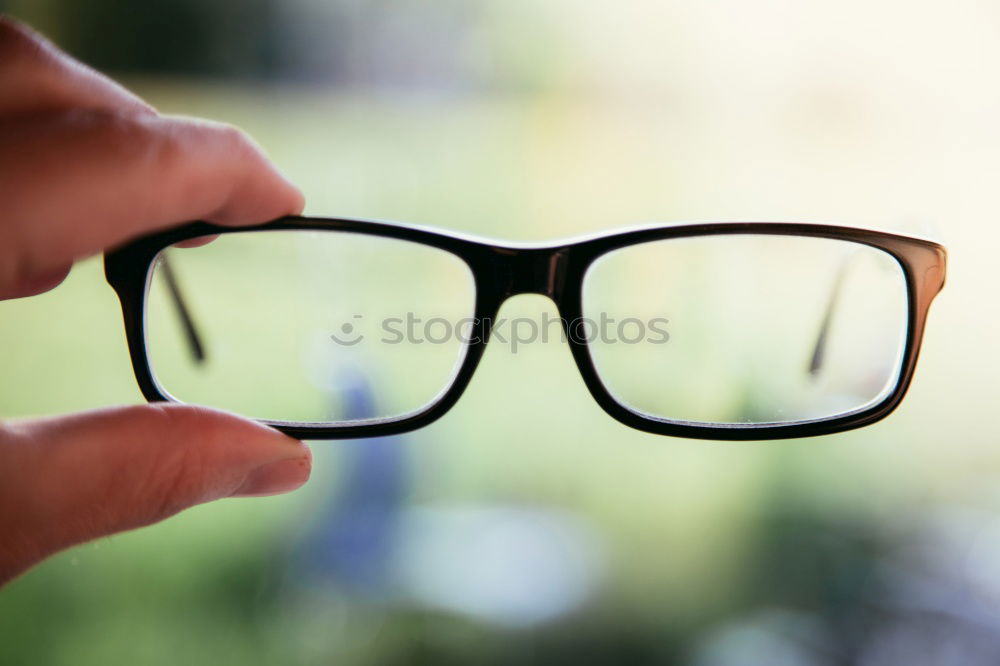 Similar – Image, Stock Photo A woman takes off her glasses