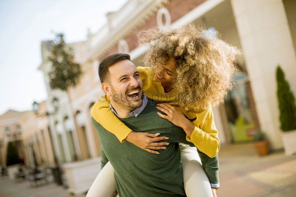 Similar – Happy girlfriend jumping on boyfriend’s back in the street