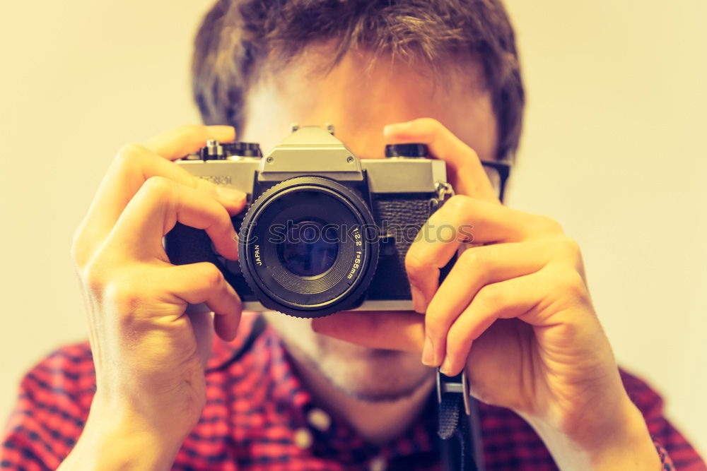 Close up of a photographer with her camera.