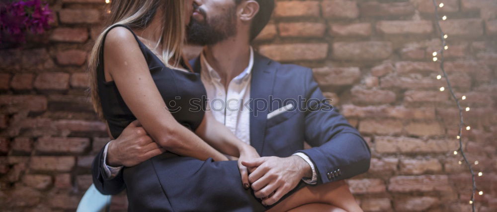 Similar – Portrait of beautiful couple in casual wear hugging in the street