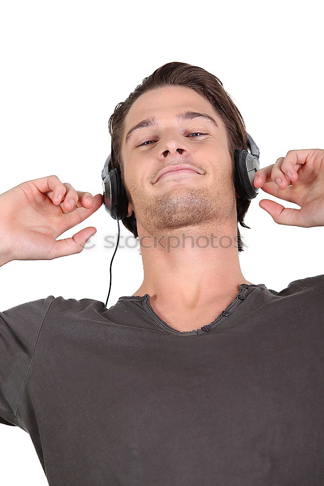 Similar – Black serious man listening to music in headphones