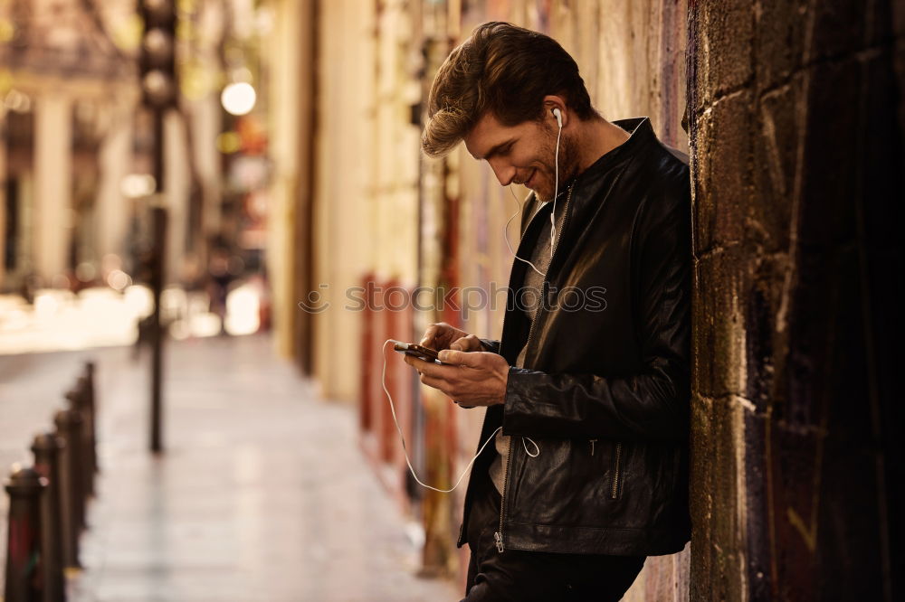 Similar – Image, Stock Photo Young urban man using smartphone in urban background.