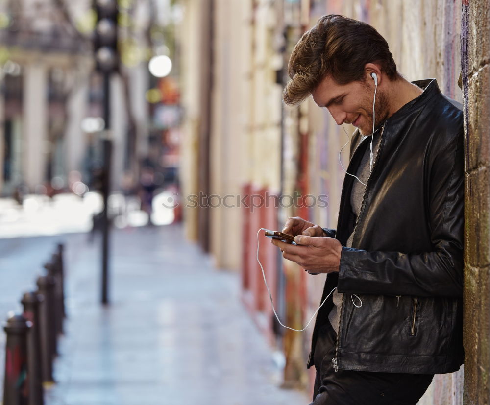 Similar – Image, Stock Photo Young urban man using smartphone in urban background.