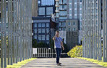 Similar – Image, Stock Photo Trendy young man walking in the street