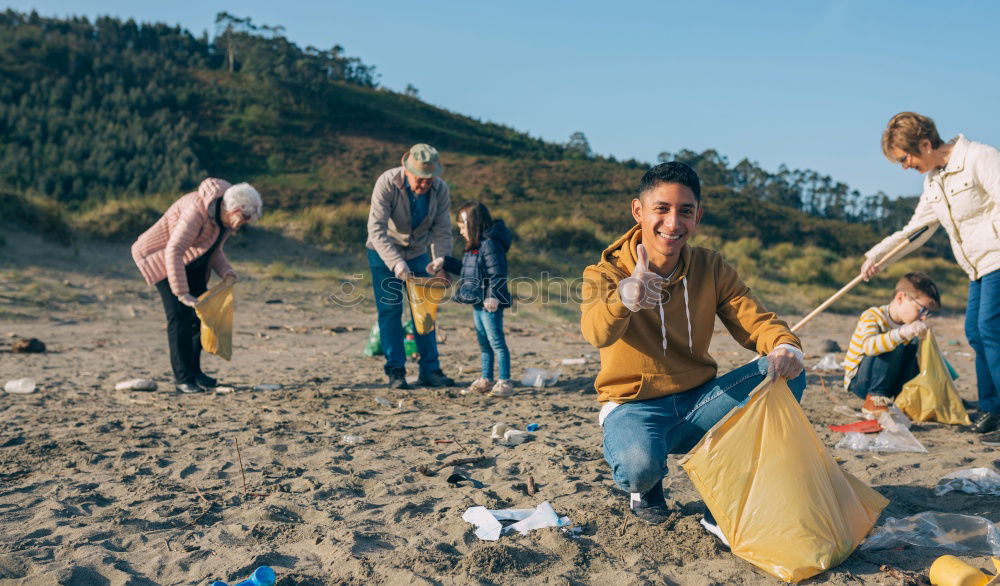 Similar – Young man cleaning the beach