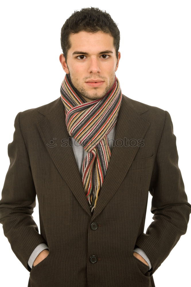 Young bearded man wearing british elegant suit outdoors