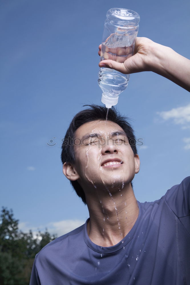 Similar – Young man drinking bottled water